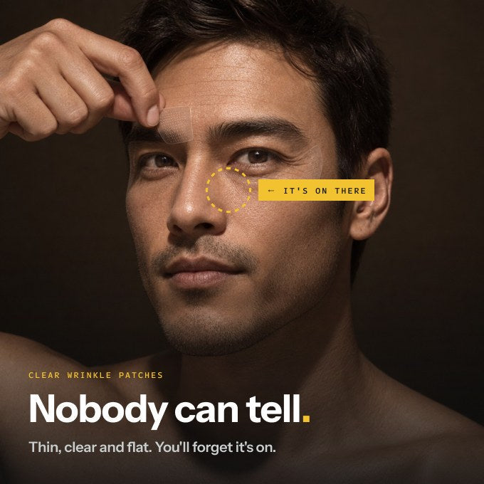 Man pressing a clear Iron patch between his brows — clear wrinkle patches nobody can tell are there